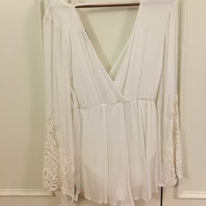 White romper with crochet bell sleeves, size small